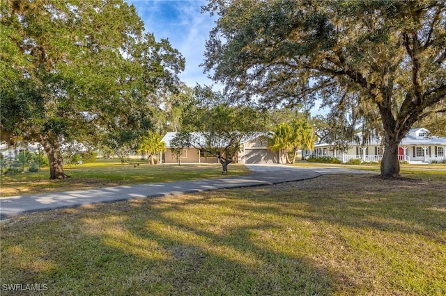 1250 Riverbend Dr, Labelle, FL 33935 - view of front of property featuring driveway and a front yard