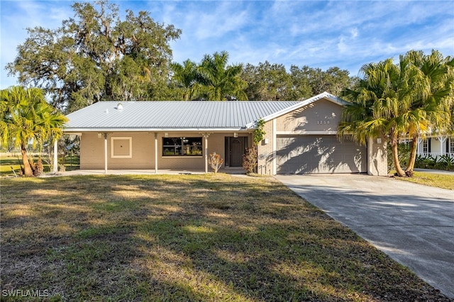 ranch-style house with a garage and a front lawn