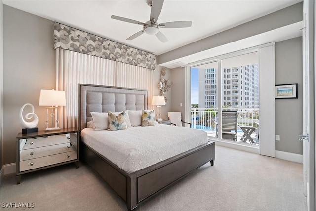 carpeted bedroom featuring access to exterior and ceiling fan