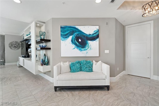 living area with an inviting chandelier