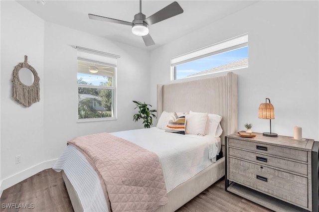 bedroom featuring hardwood / wood-style floors and ceiling fan