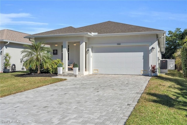 view of front of home featuring a garage and a front lawn