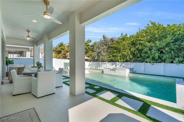 view of pool featuring ceiling fan and a patio area