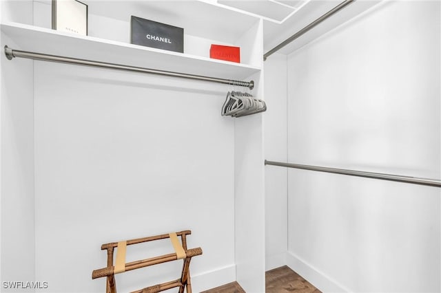 walk in closet featuring hardwood / wood-style flooring