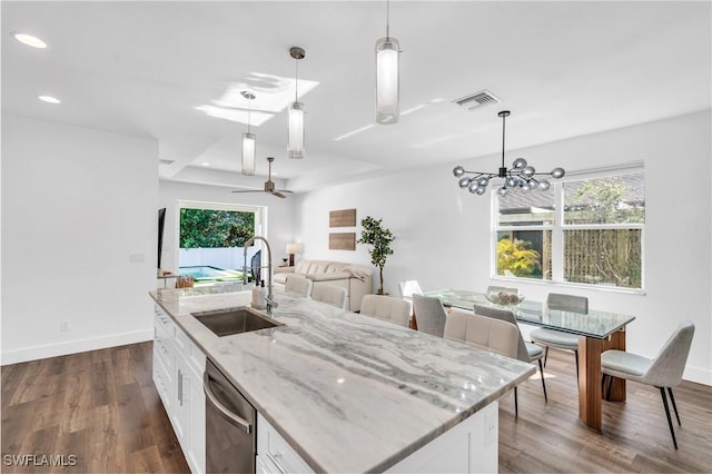 kitchen with sink, stainless steel dishwasher, an island with sink, pendant lighting, and white cabinets