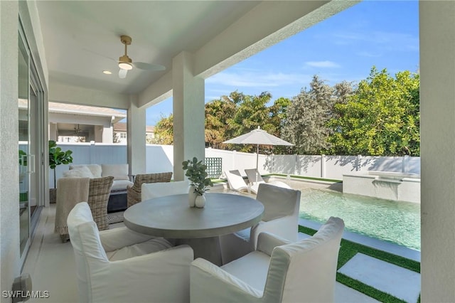 view of patio / terrace featuring ceiling fan, an outdoor hangout area, and a fenced in pool