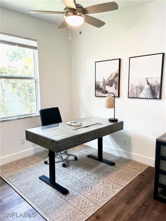 office area with dark hardwood / wood-style flooring and ceiling fan