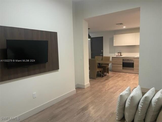 living room with light wood-type flooring