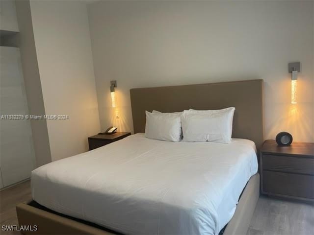 bedroom with light wood-type flooring