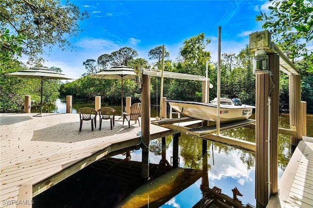 216 Cocohatchee Blvd, Naples, FL 34110 - dock area featuring boat lift and a water view
