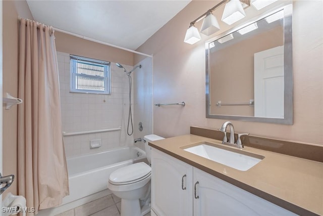 full bathroom featuring tile patterned floors, vanity, toilet, and shower / bath combo with shower curtain