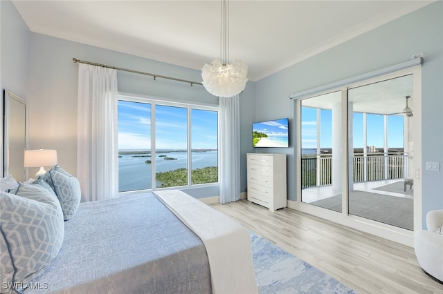 bedroom with access to exterior, crown molding, and light hardwood / wood-style floors