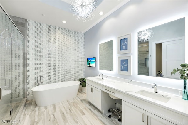 bathroom with vanity, wood-type flooring, shower with separate bathtub, and tile walls