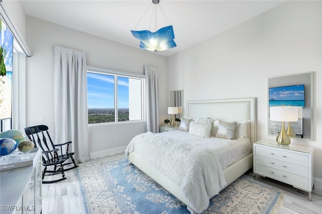 bedroom featuring light wood-type flooring