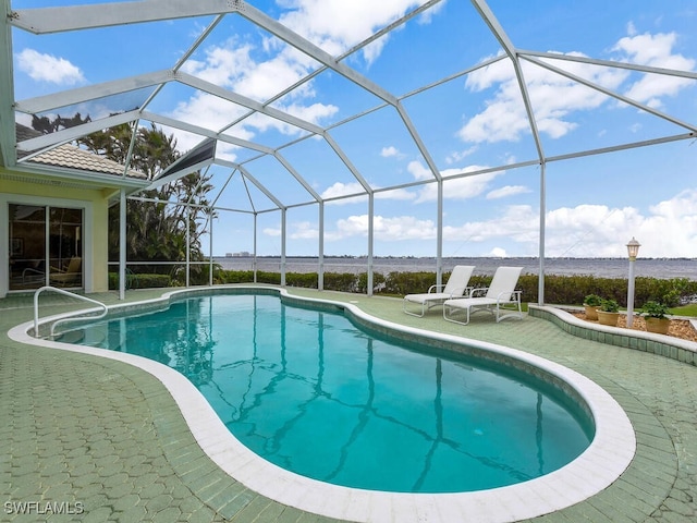 view of pool featuring a patio area and glass enclosure