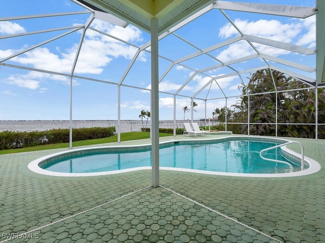 view of pool featuring a water view, a lanai, and a patio