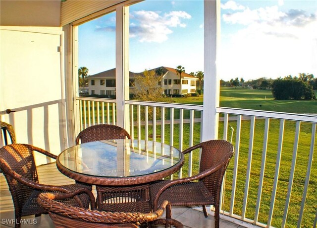 1580 Pine Valley Dr Unit 217, Fort Myers, FL 33907 - balcony with outdoor dining space