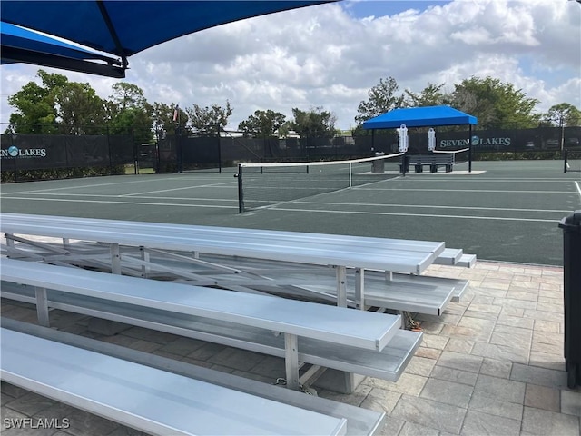 view of tennis court with fence