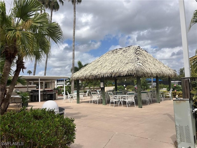 1580 Pine Valley Dr Unit 217, Fort Myers, FL 33907 - view of property's community with a gazebo, a patio area, and outdoor dining area