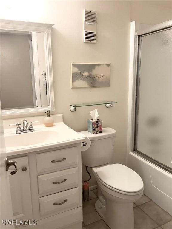 bathroom featuring toilet, tile patterned flooring, visible vents, and vanity