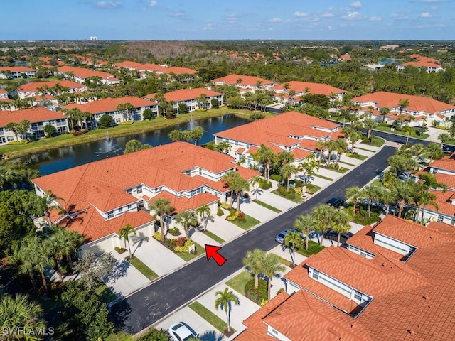 drone / aerial view with a water view