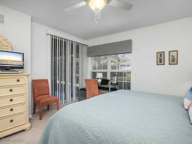 bedroom featuring ceiling fan, light colored carpet, and access to exterior