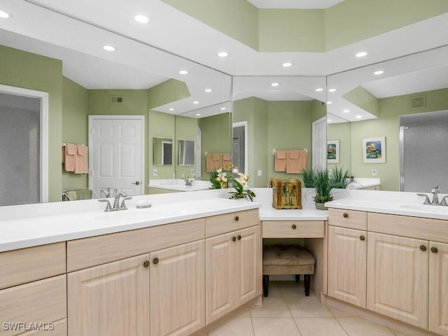 bathroom with tile patterned floors and vanity