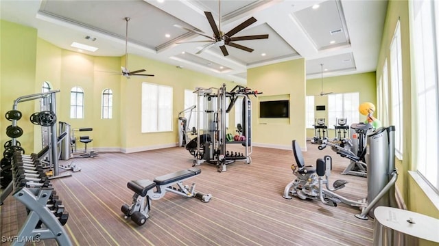 workout area featuring carpet, coffered ceiling, and ceiling fan