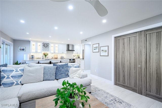 living room featuring ceiling fan