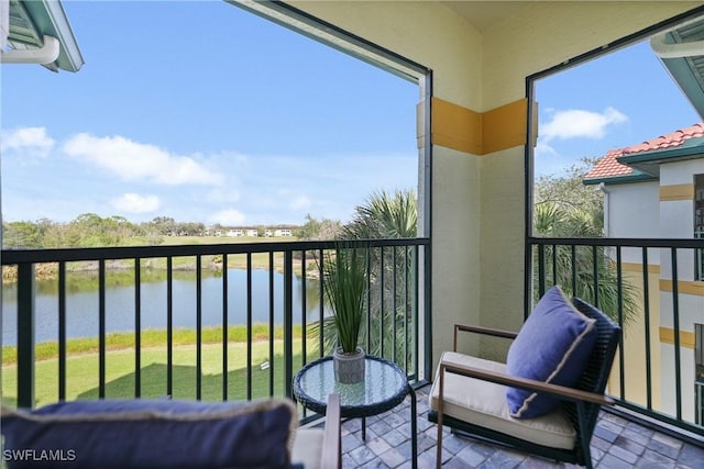 balcony featuring a water view