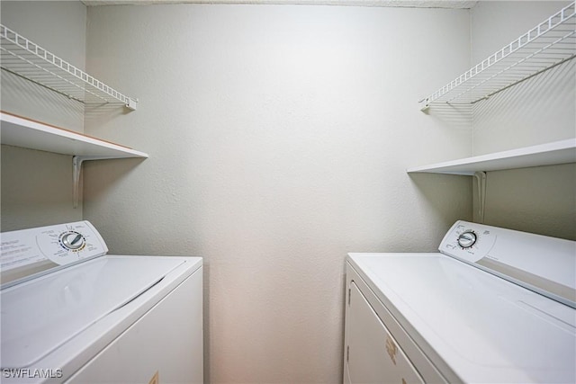 laundry room featuring washing machine and dryer