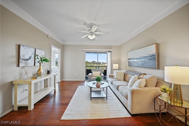 living room with crown molding, dark hardwood / wood-style floors, and ceiling fan