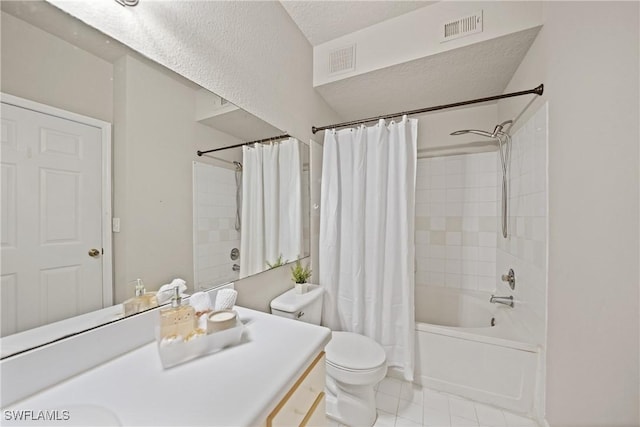 full bathroom featuring tile patterned flooring, vanity, toilet, shower / bath combo, and a textured ceiling