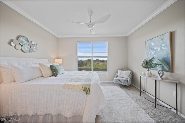 carpeted bedroom featuring ornamental molding and ceiling fan