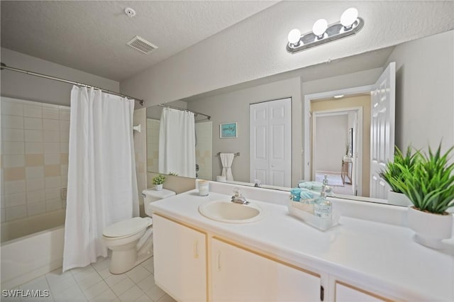 full bathroom with shower / bathtub combination with curtain, tile patterned flooring, vanity, a textured ceiling, and toilet