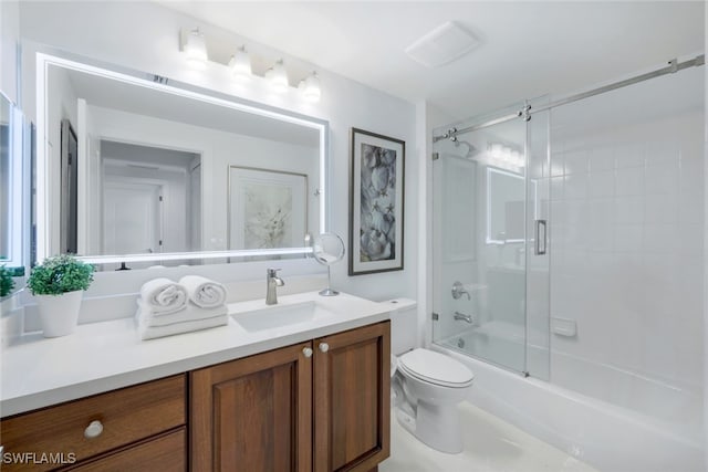 full bathroom featuring vanity, enclosed tub / shower combo, and toilet