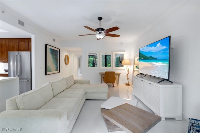 living room with crown molding and ceiling fan