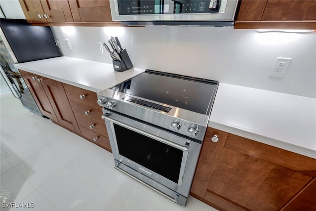 kitchen with stainless steel range with electric stovetop