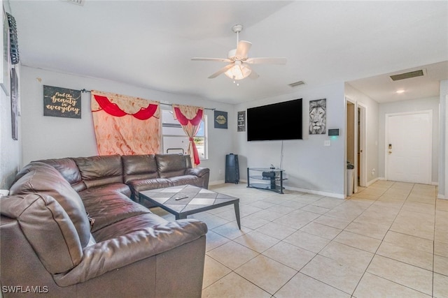 217/219 Ivan Ave S, Lehigh Acres, FL 33973 - living area with light tile patterned floors, baseboards, a ceiling fan, and visible vents