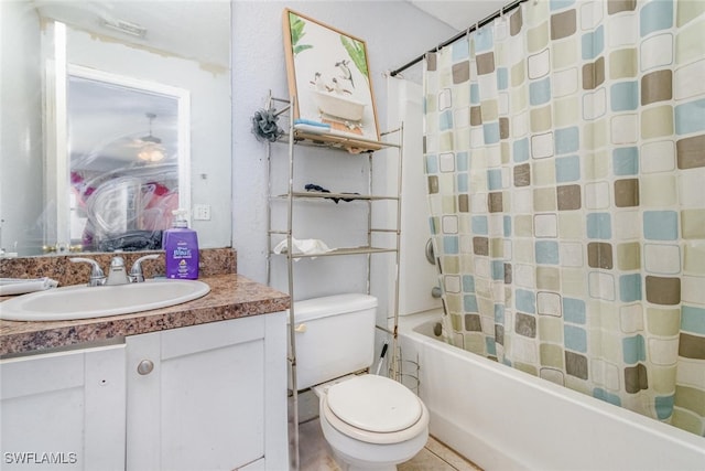 217/219 Ivan Ave S, Lehigh Acres, FL 33973 - bathroom featuring vanity, toilet, and shower / bath combo with shower curtain