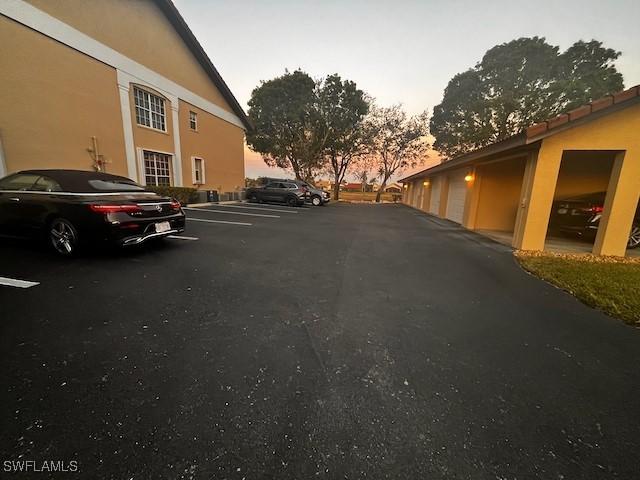 view of parking at dusk