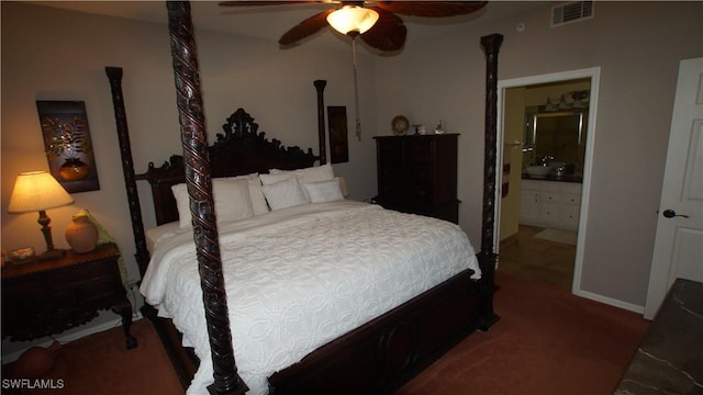 bedroom featuring ceiling fan, visible vents, and connected bathroom