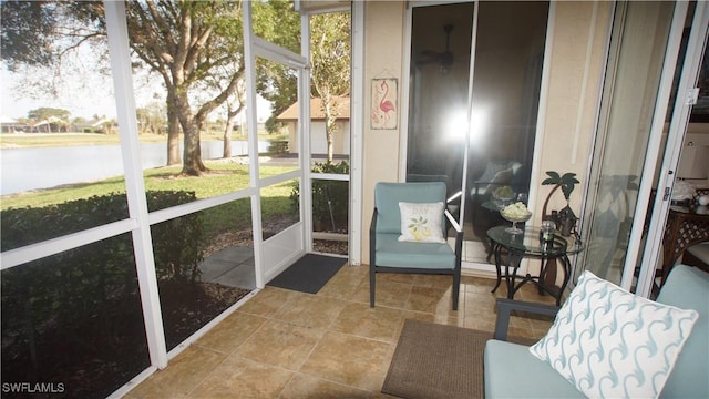 sunroom with a water view