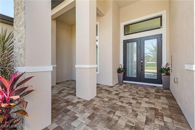 entrance to property featuring french doors