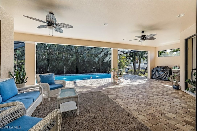 view of patio / terrace featuring an outdoor living space, pool water feature, a lanai, and ceiling fan