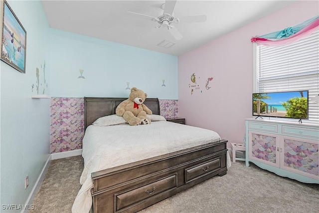 bedroom featuring light colored carpet and ceiling fan