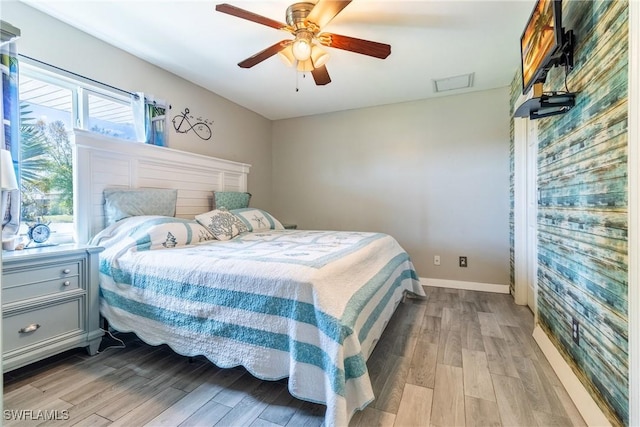 bedroom featuring ceiling fan and light wood-type flooring