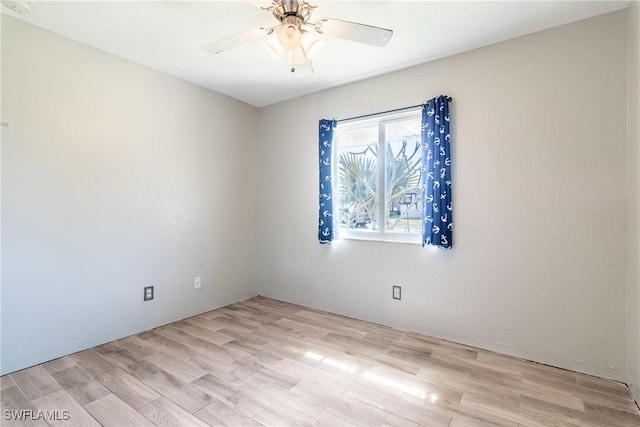 spare room featuring ceiling fan and light wood-type flooring