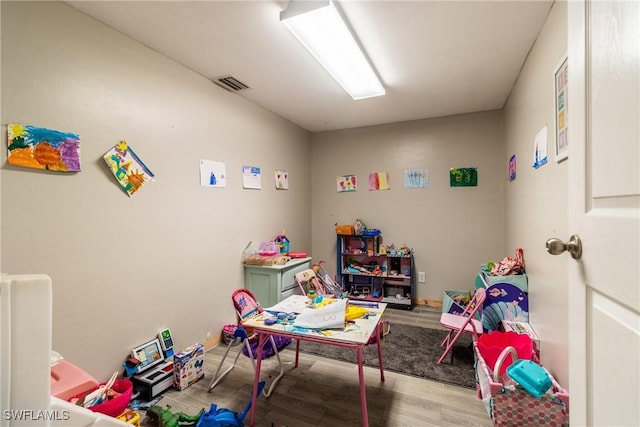 playroom featuring light wood-type flooring