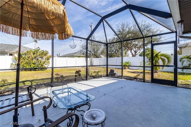 view of patio with a lanai